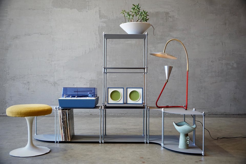2 corner tables, 4 standard tables, 1 inside corner table, 2 sets of vertical locks.  Cement gray powdercoat finish.